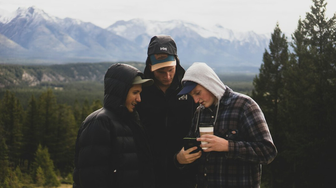 Group of friends laughing together outdoors